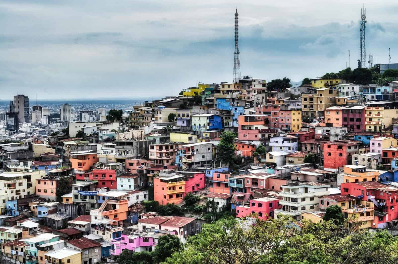 Colorful hillside neighborhood in Guayaquil, Ecuador, showcasing vibrant urban architecture.