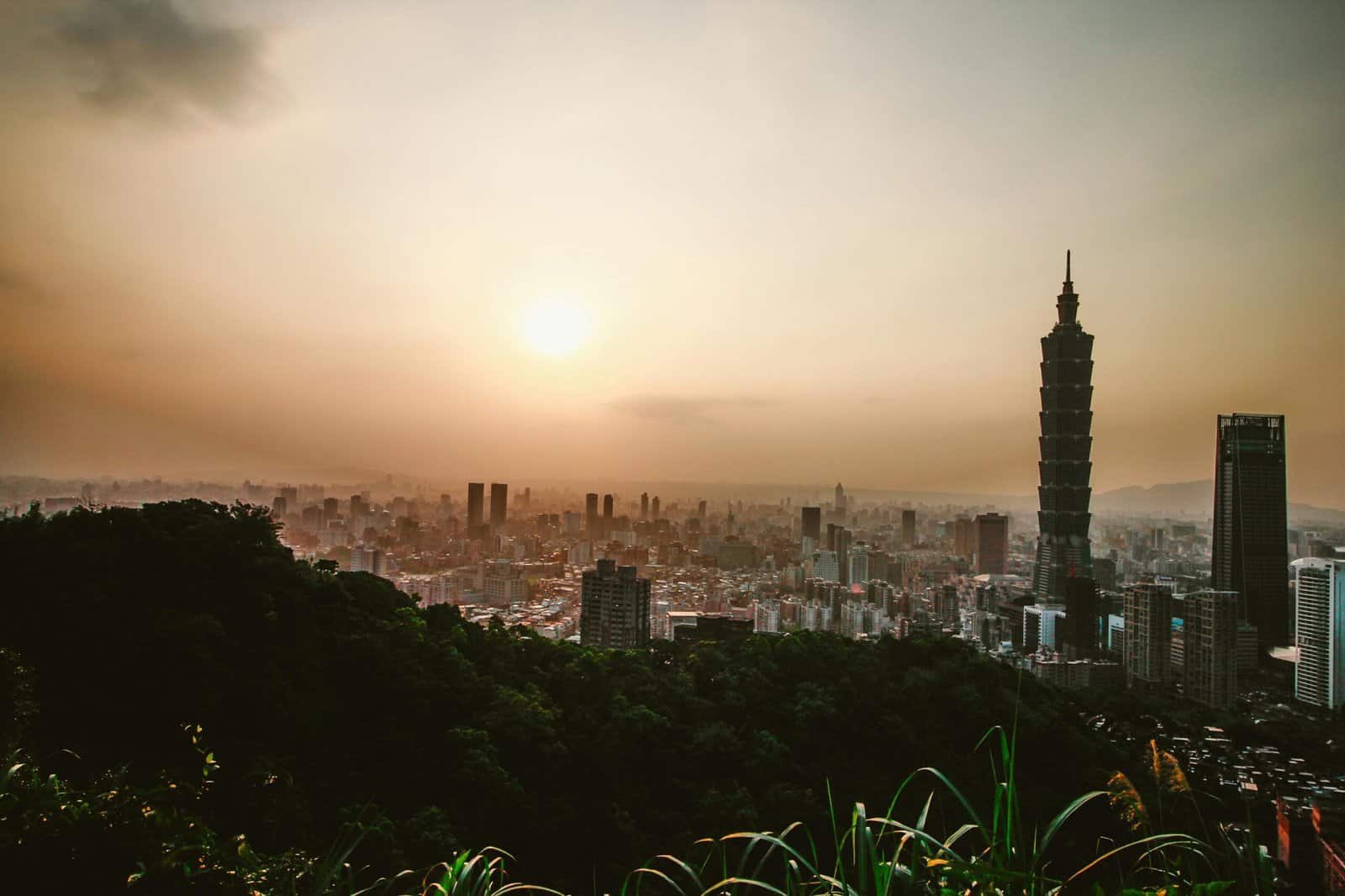 Beautiful sunset skyline featuring Taipei 101 and the urban landscape of Xinyi District in Taiwan.